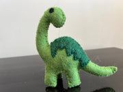 Felt dinosaur toy with green patch