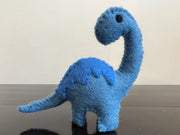Felt dinosaur toy with blue patch 