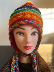 Multicolor knitted woolen sherpa hat with earflaps.