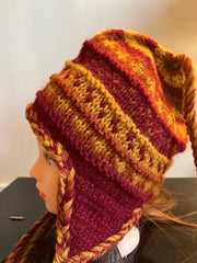 Multicolor knitted woolen sherpa hat with earflaps.