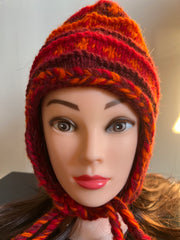 Multicolor knitted hat with ear flaps. 