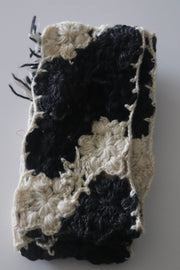 Hand knitted scarf  in black and white color.