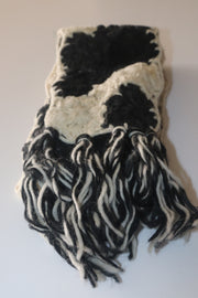Hand knitted scarf in black and white color.