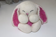 Feltmade bunny in Pink color. Has long ears.